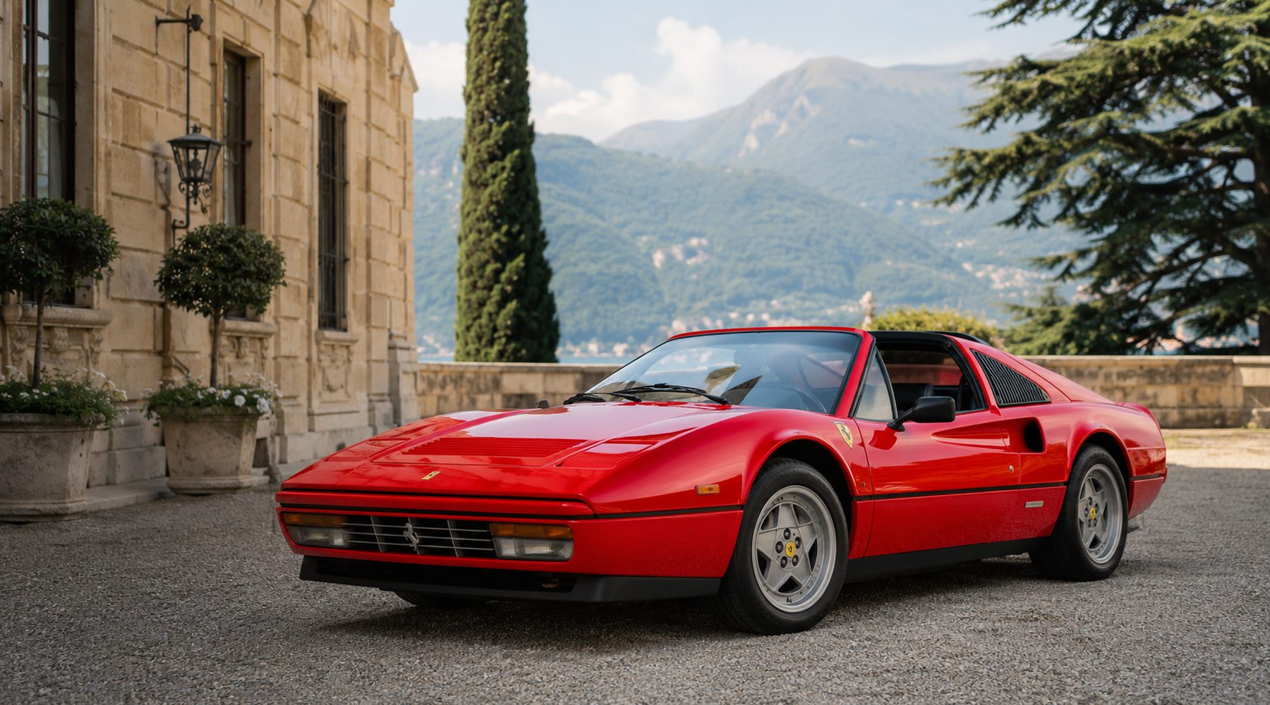 A red Ferrari 328 GTS outside a stone villa